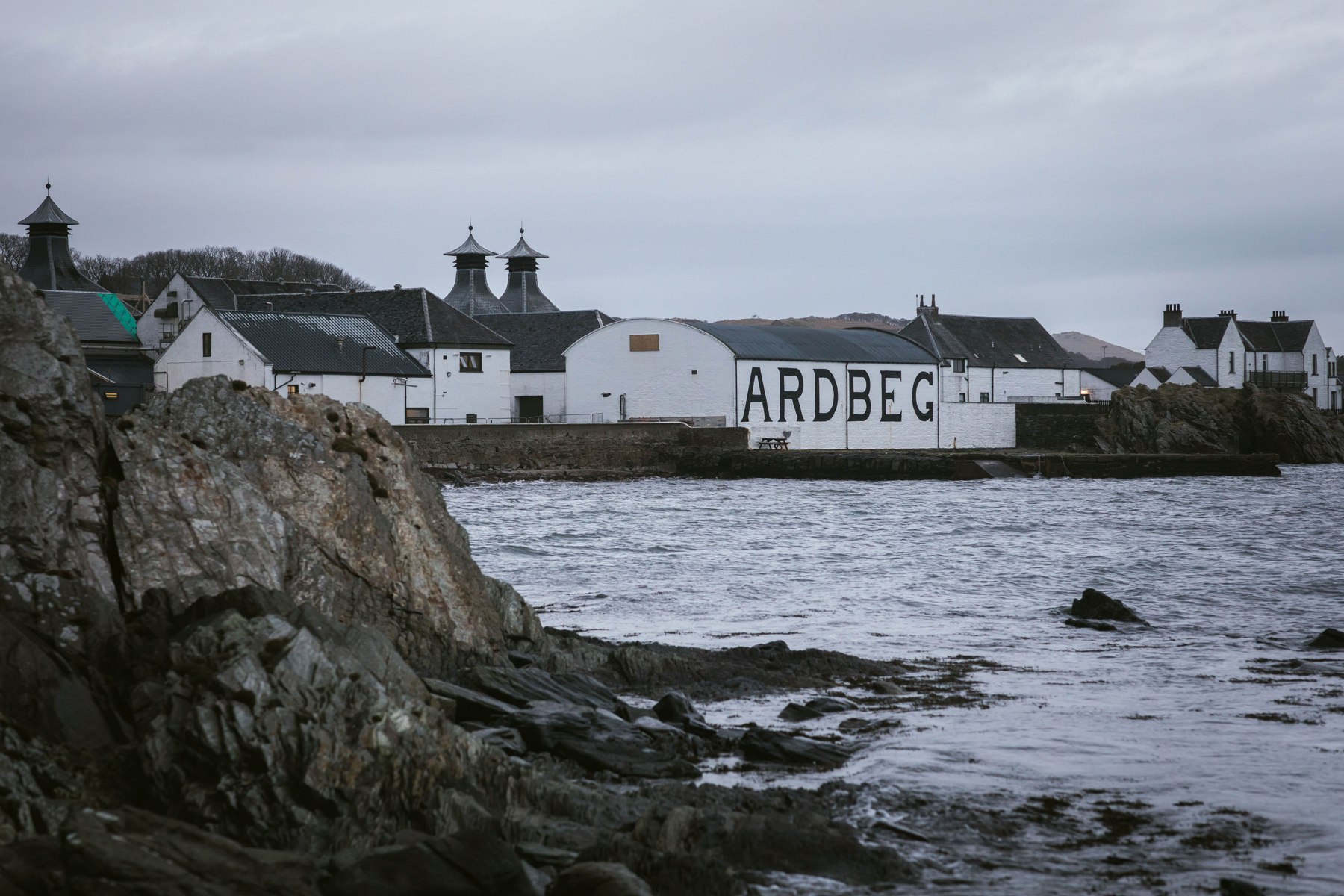 Ardbeg viewed across the water from the rocky coast