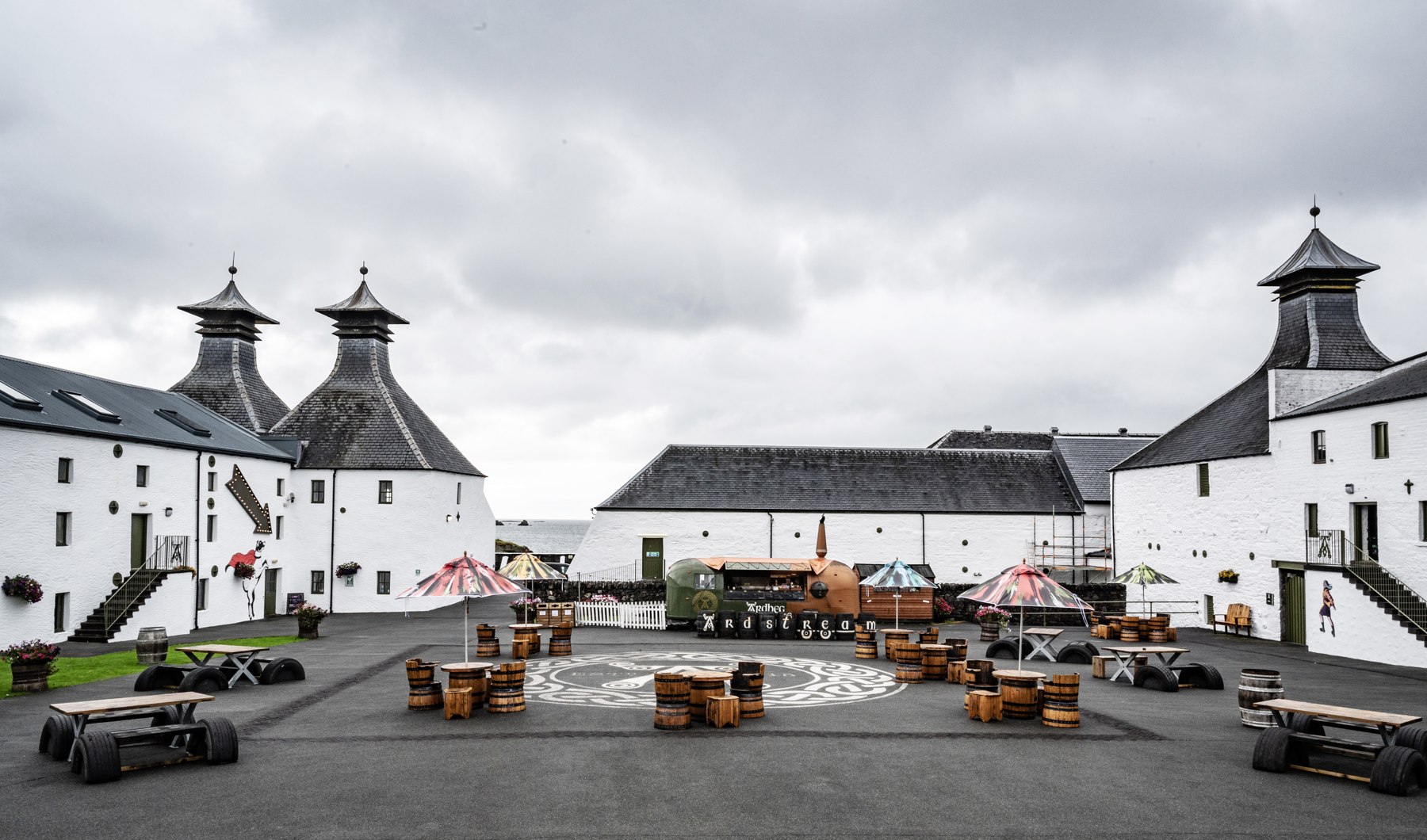 Ardbeg’s courtyard between white distillery buildings