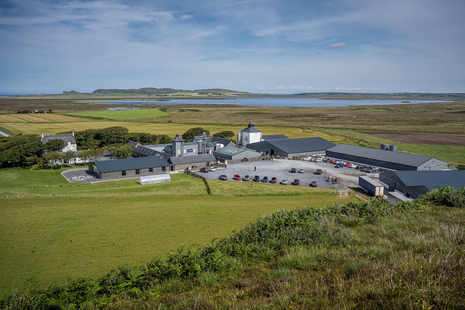 Kilchoman’s white distillery buildings and surrounding Islay farmland