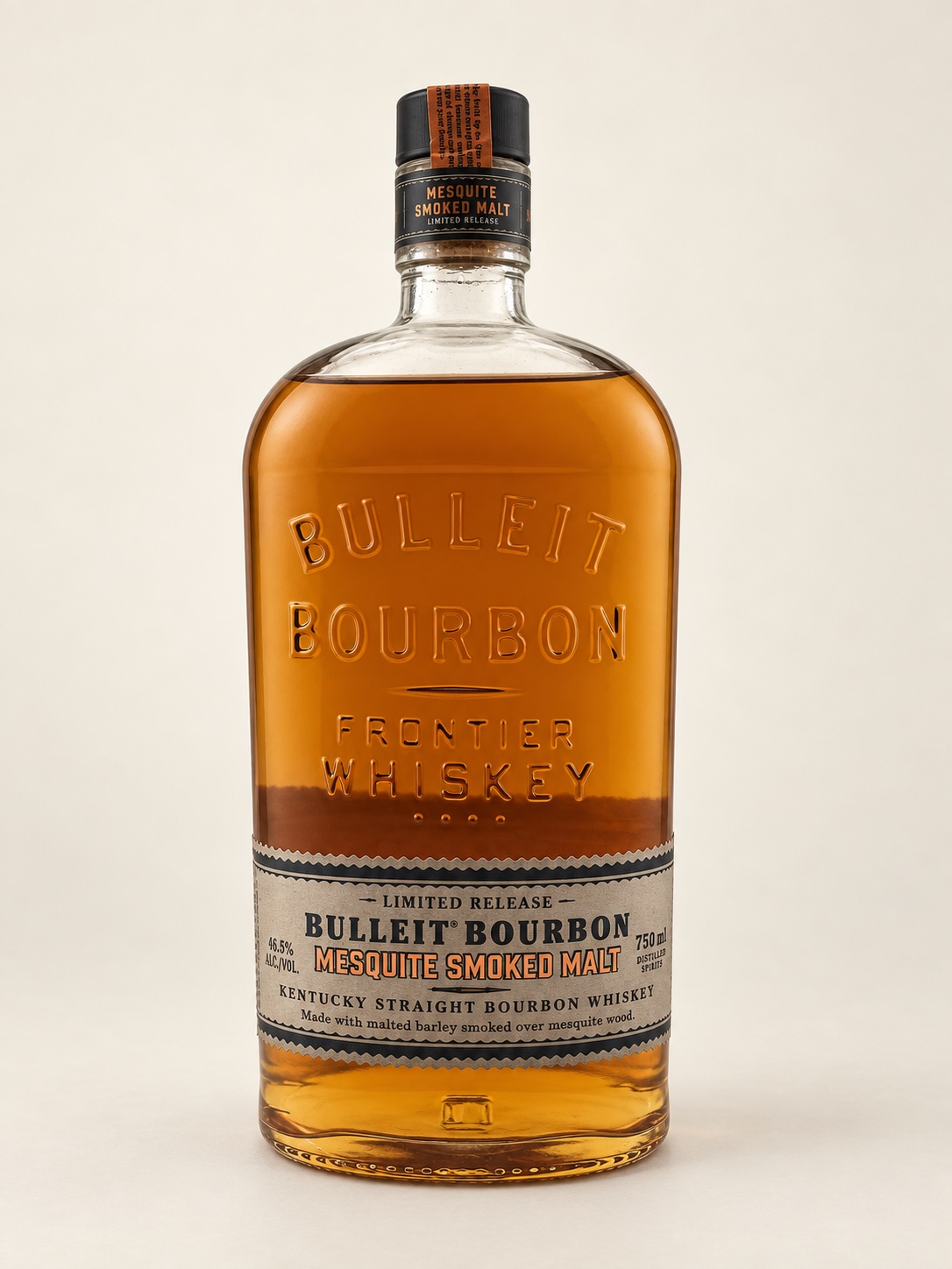 Bulleit Mesquite Smoked Malt Bourbon bottle with embossed glass, a cream-and-black label and orange lettering