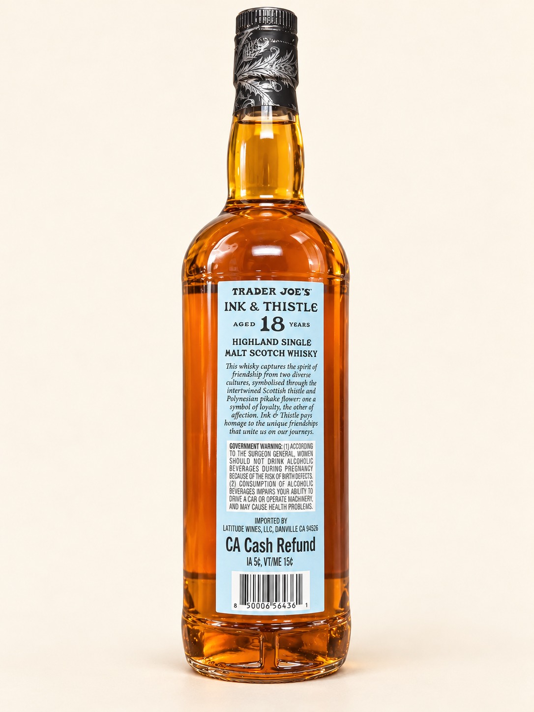 AI-retouched rear Ink and Thistle 18 bottle with pale blue label